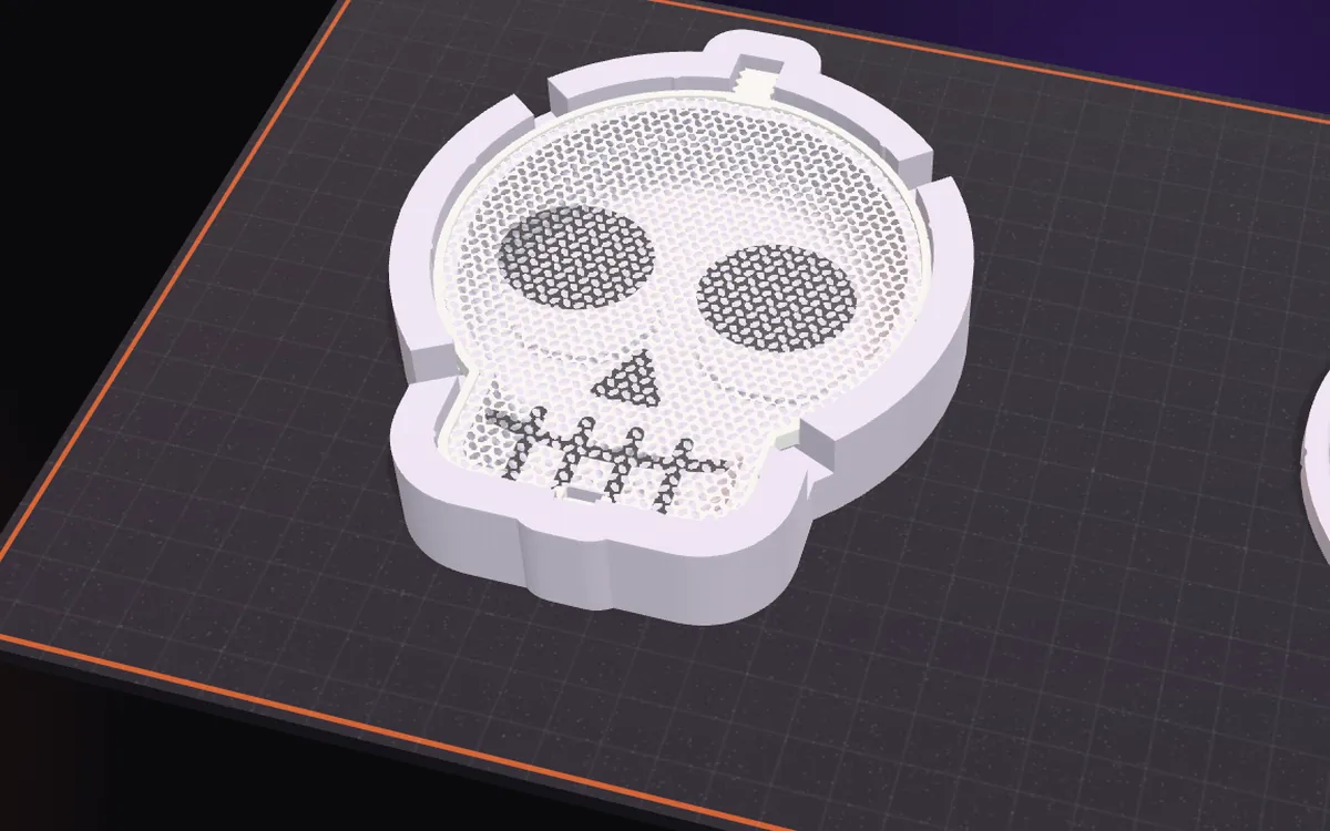 A flat skull mesh lying in the bottom mold, rim in its recess