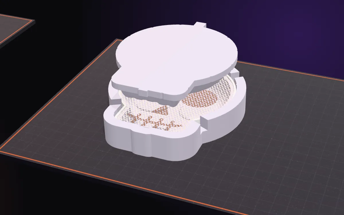 The top mold pressed down on the bottom mold with the mesh between them