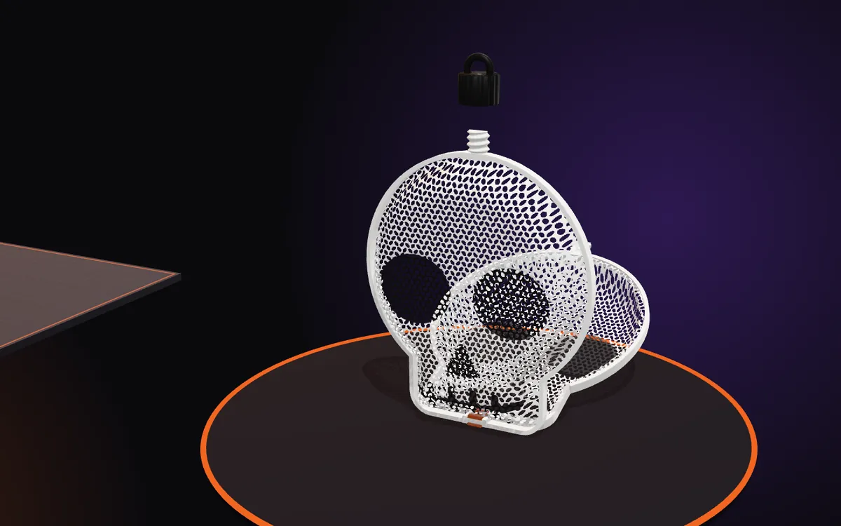 The two domed skull halves closing on the clip at the bottom